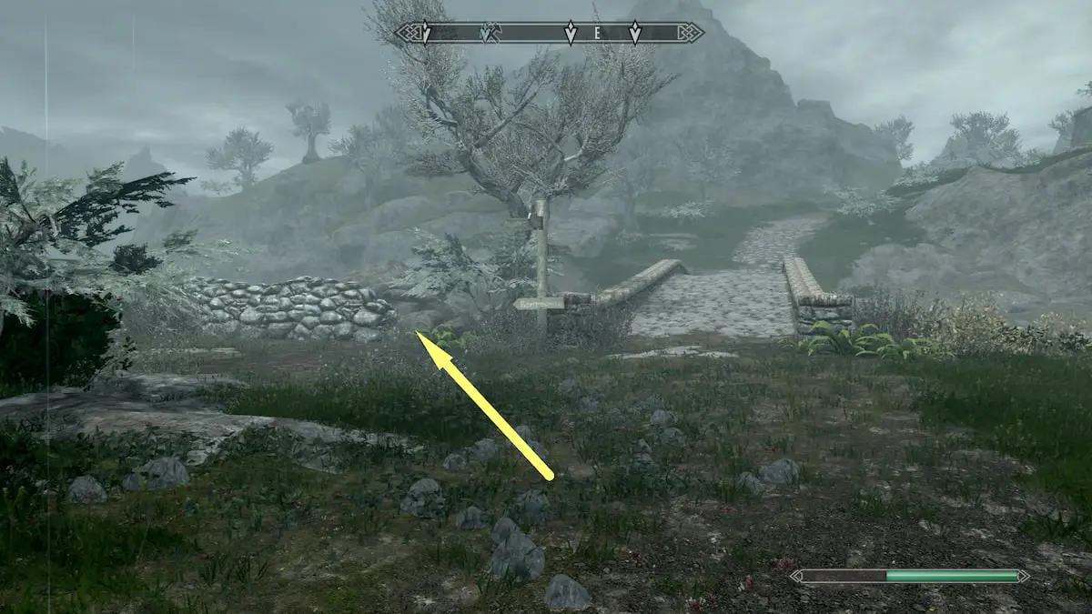 Markarth bridge, wooden sign post, and low stone wall beside it