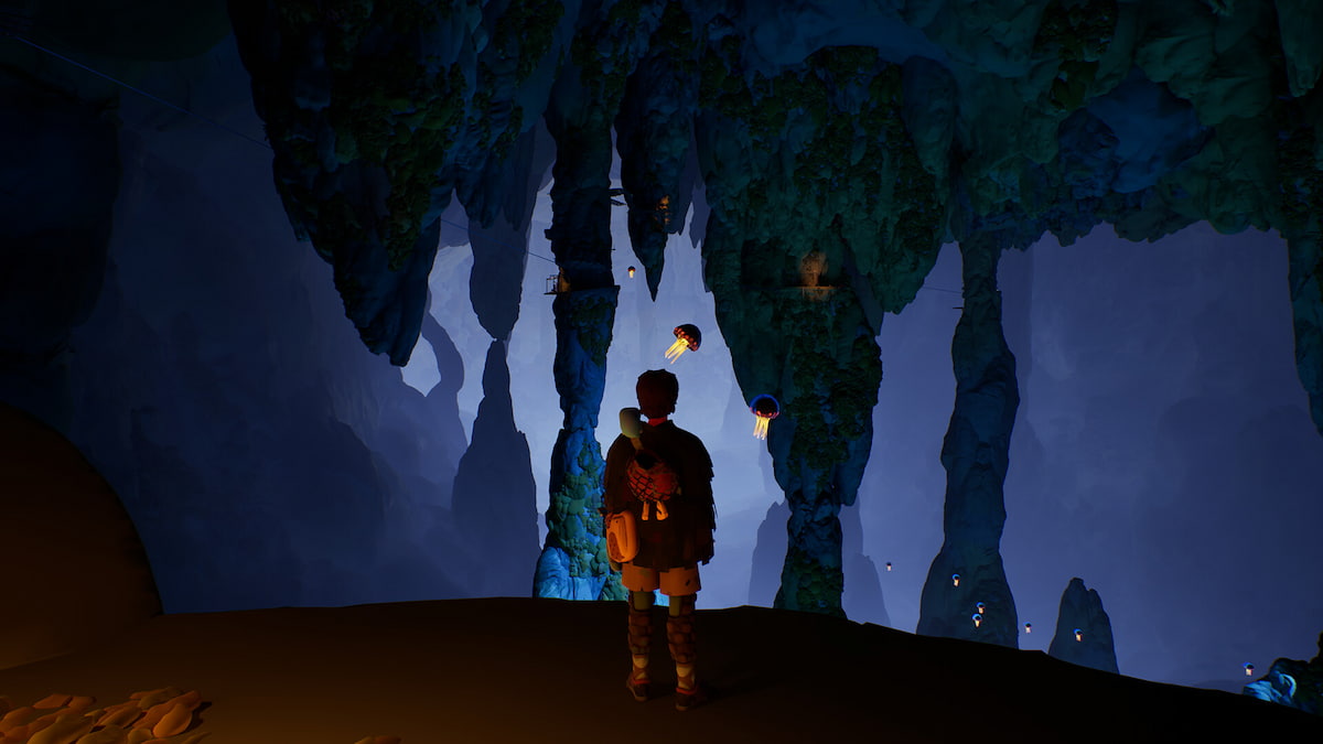 Jusant main character standing in a cave with jellyfish-like creatures