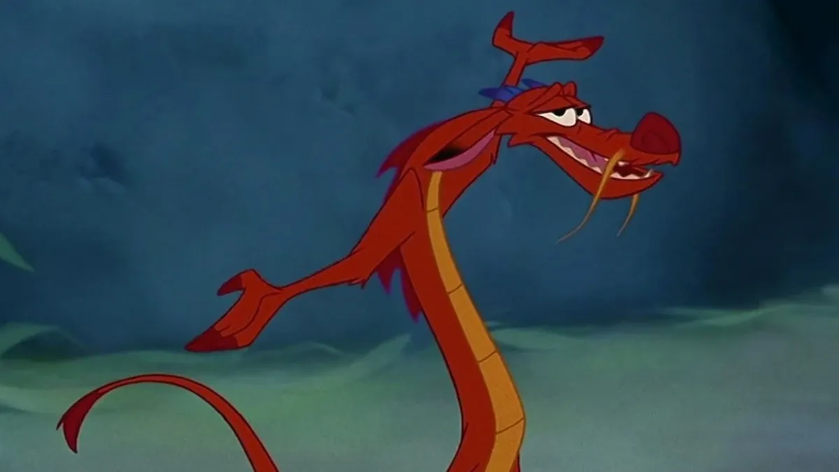 Mushu the dragon from Mulan with arms outstretched and smiling