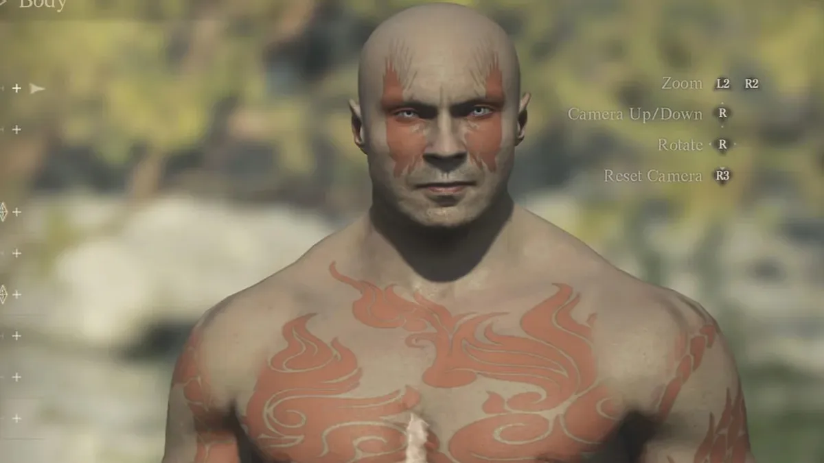 Drax from Guardians of the Galaxy, bald head, greyish brown skin and reddish tattoos that cover his face and body.