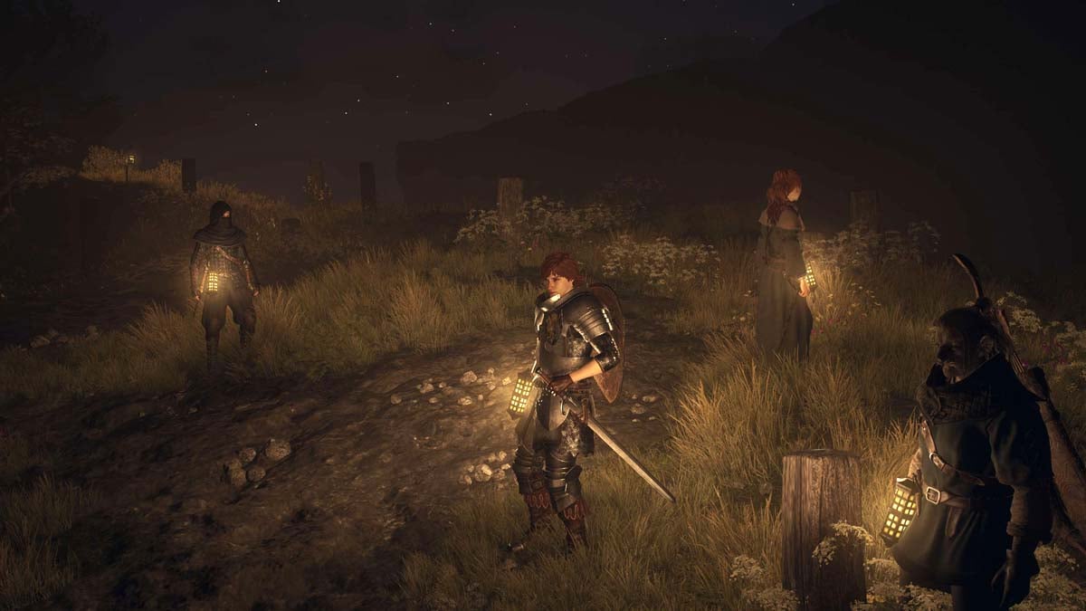 Dragon's Dogma 2 characters holding lanterns at night