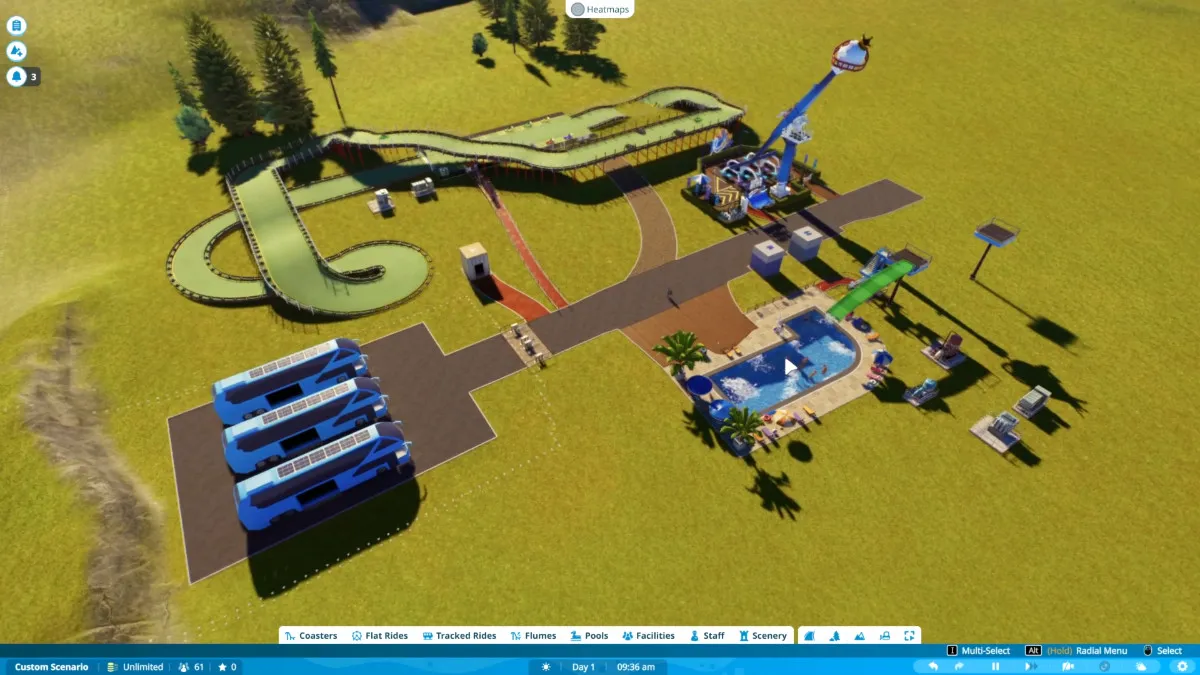 A small theme park in Planet Coaster 2 featuring a pool, a ground ride, and a go-kart track.