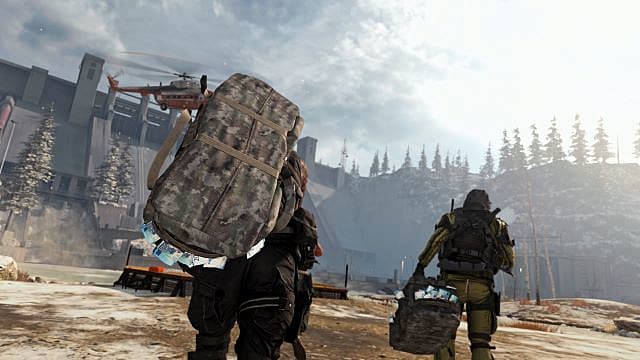 Players carry cash bags to a helipad drop point. 