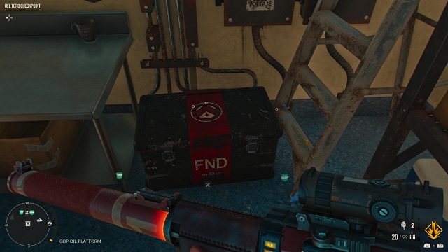 Red and black FND cache on the ground.