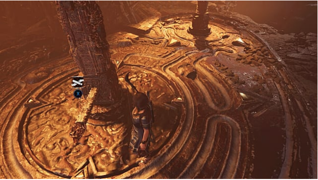 Lara stands on the brown, channeled floor next to a wooden lever