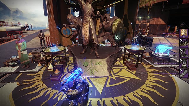 A Warlock kneels in front of a gold Hunter, Warlock, Titan statue at the Tower as Eva Levante watches.