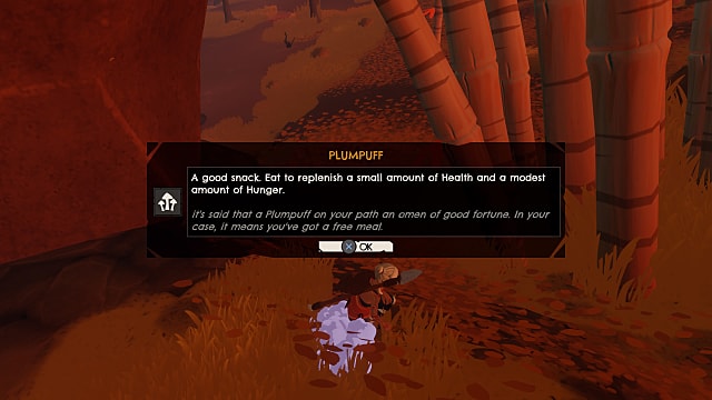 Kara, holding a spear, picks up a plumpuff mushroom on brown grass, with a menu describing the item in Windbound.